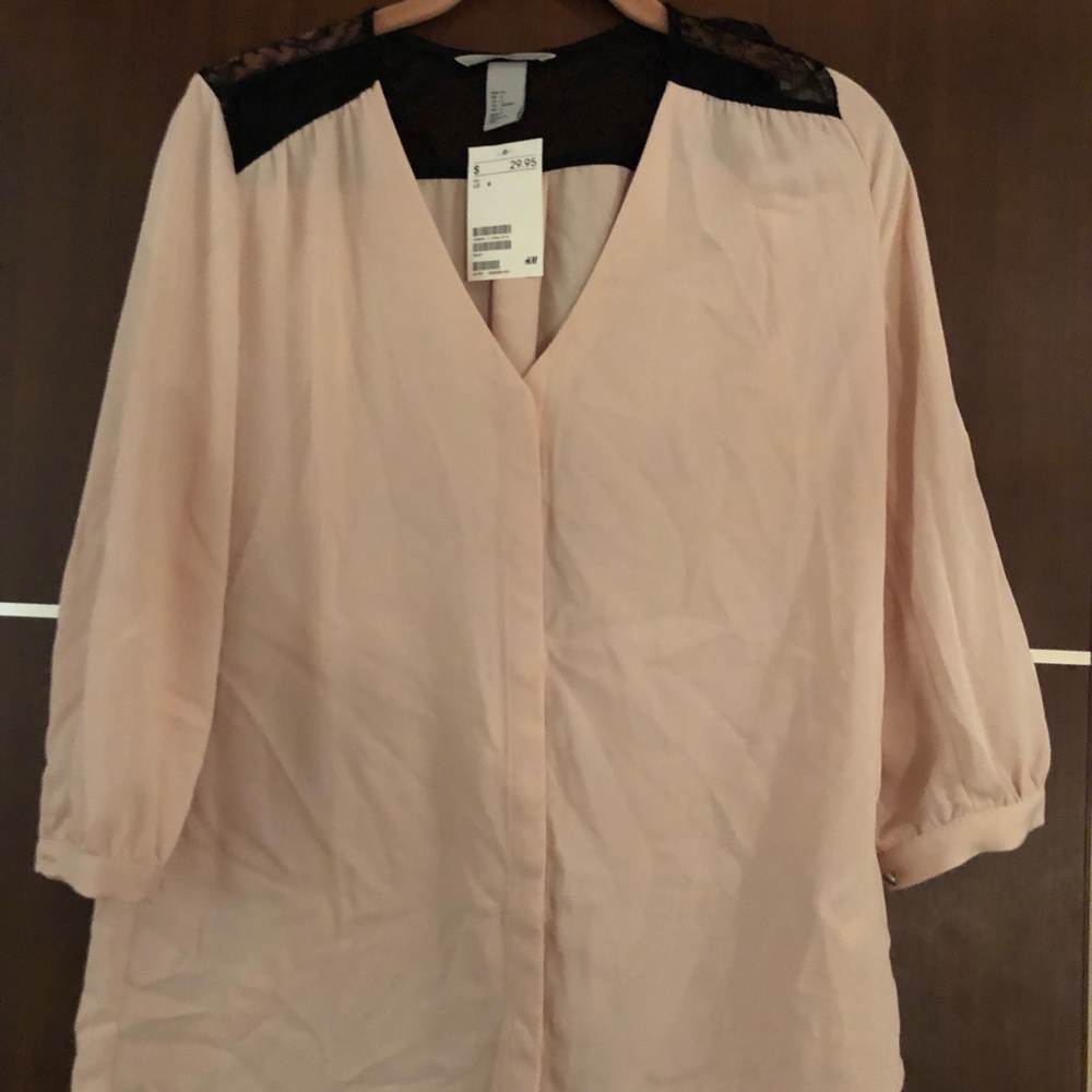 H&M women’s pink & black lace blouse in size 6.